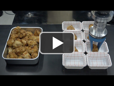 SOFTmatics™ applications Picking of fried chicken in bulk stacks.